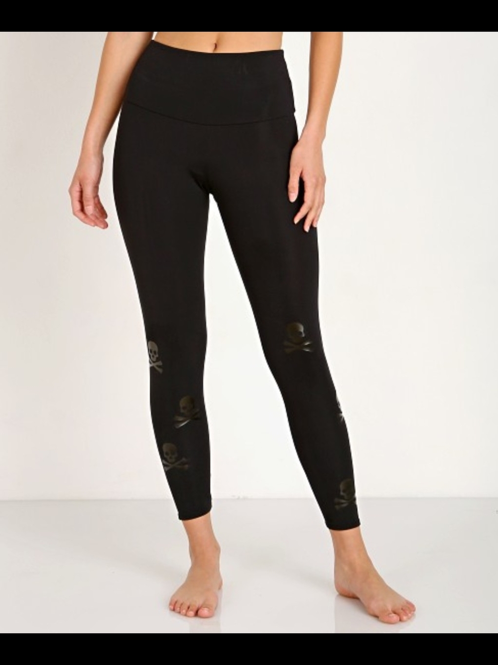 Skull Print Onzie Midi Leggings in a matte black. Size S/M